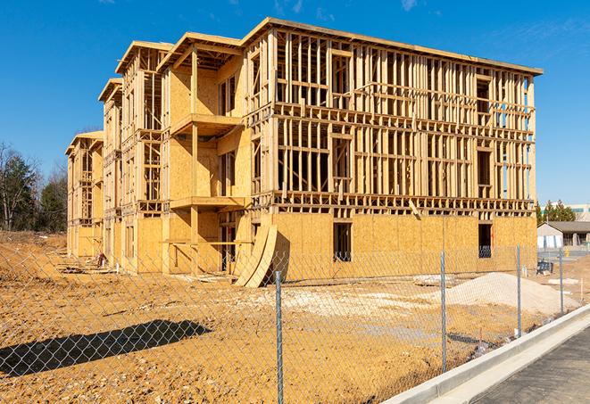 a temporary chain link fence in front of a building under construction, ensuring public safety in Atlantic Highlands NJ